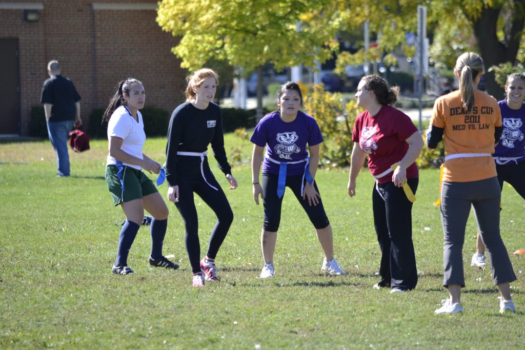 students in huddle for flag football
