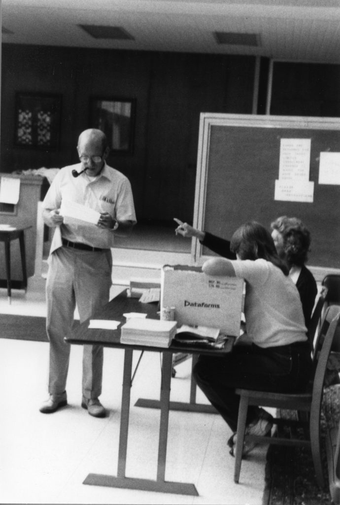 Professor reviewing a document.