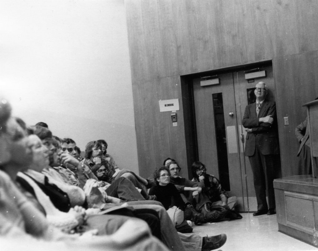 Law School dean watching over a class.