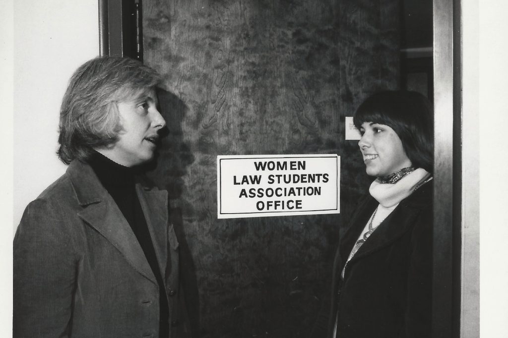 two women talking in front of WLSA door
