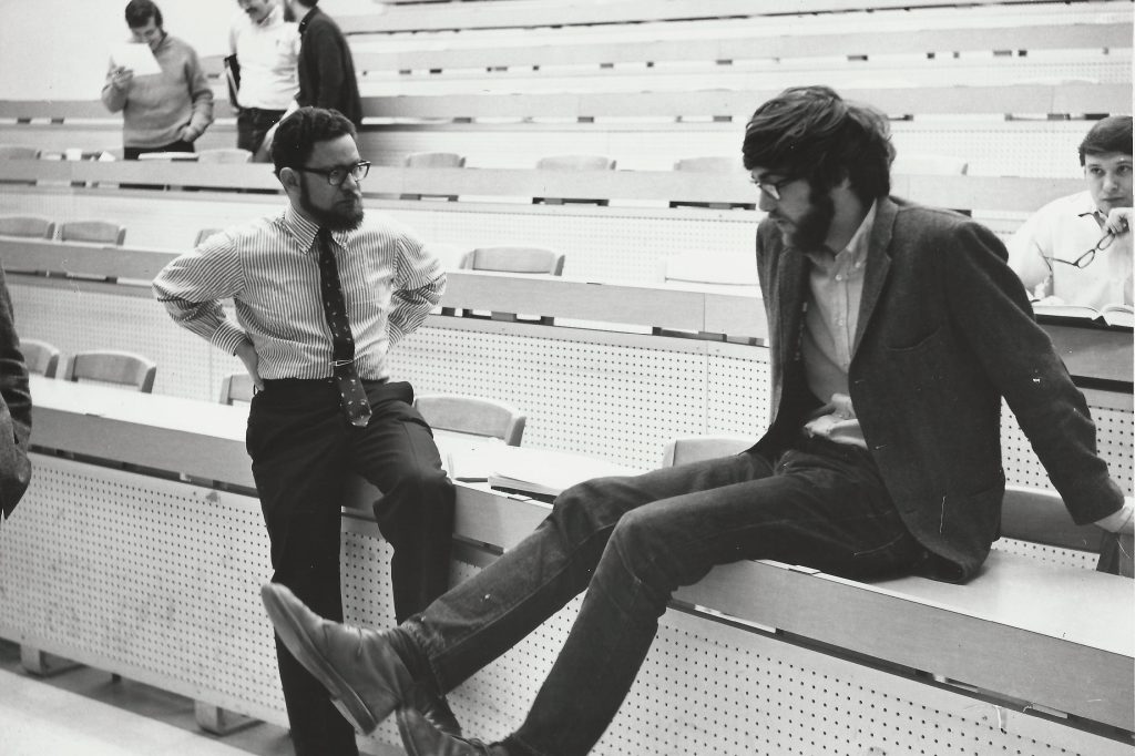 Professor talking with student.