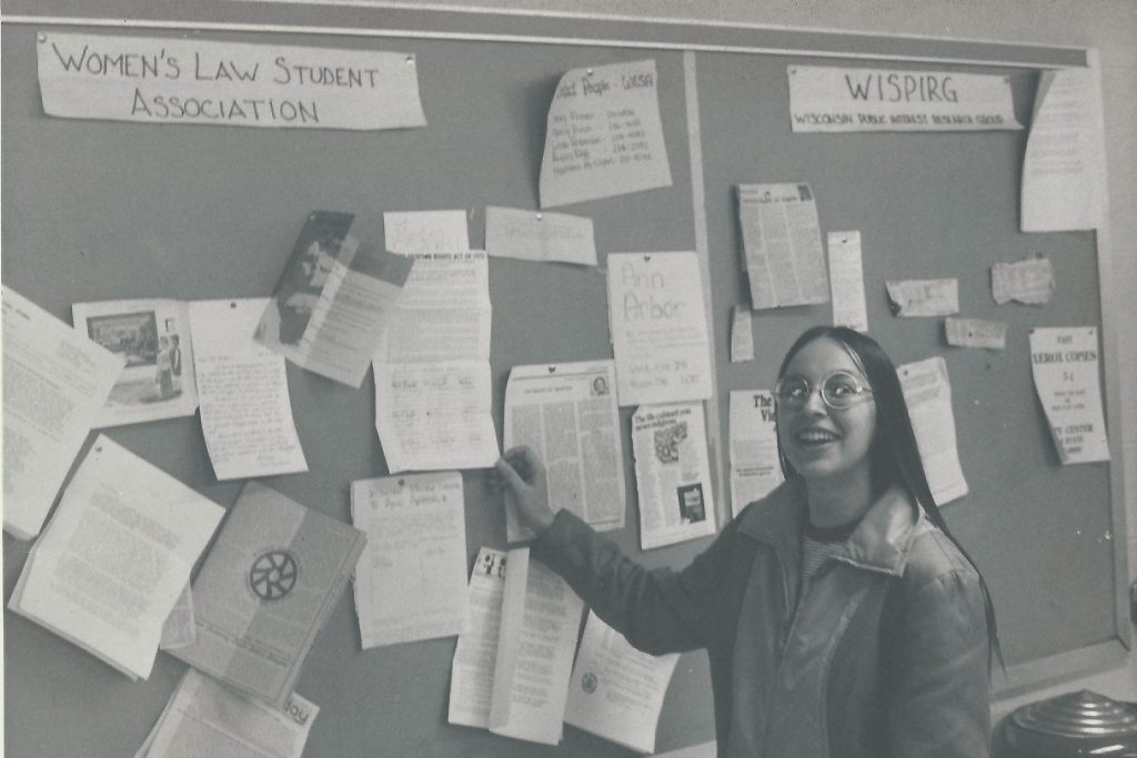 student in front of board