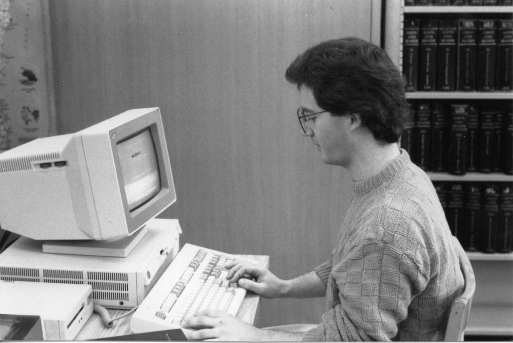 Law student using a library computer