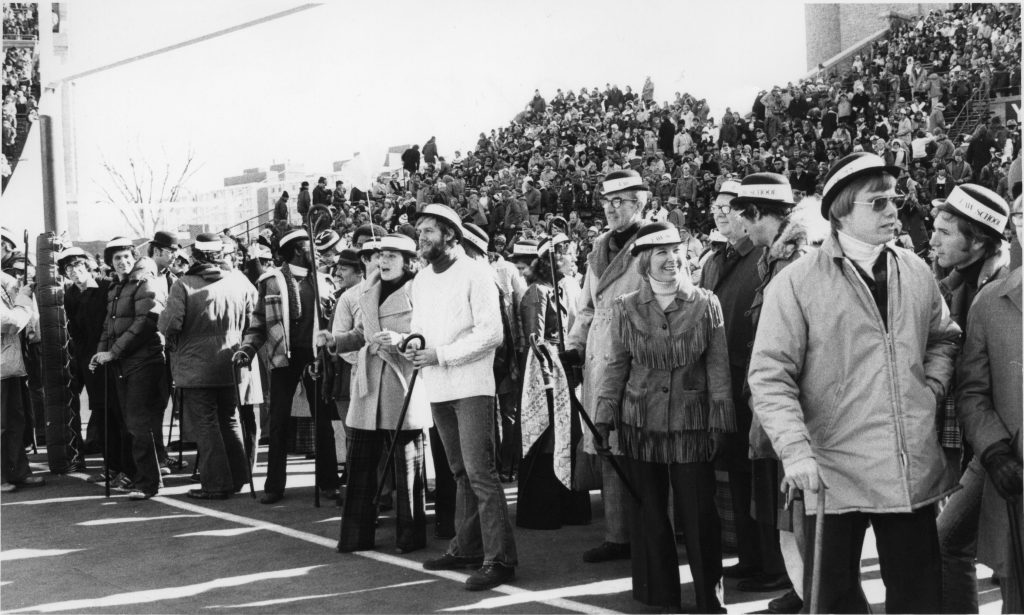 Student wait to run across the field.