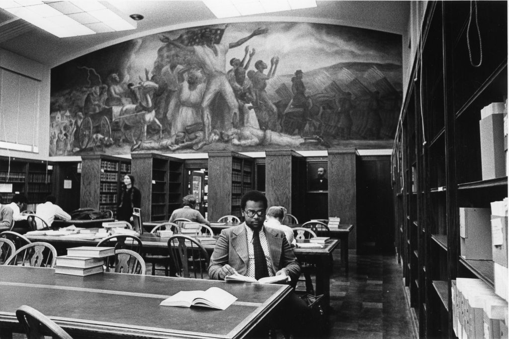 Students in the Law Library with the mural, "Freeing of the Slaves".