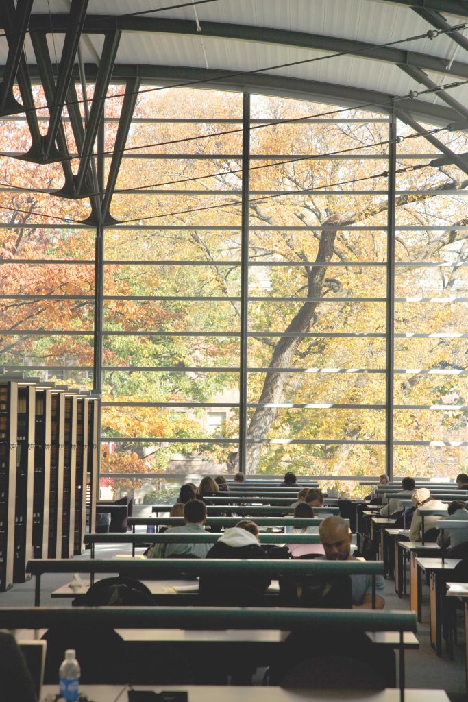 Bascom Hill in autumn through Law Library windows