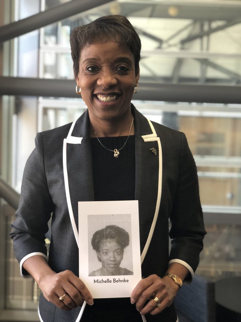 Michelle Behnke holds her class exit photo