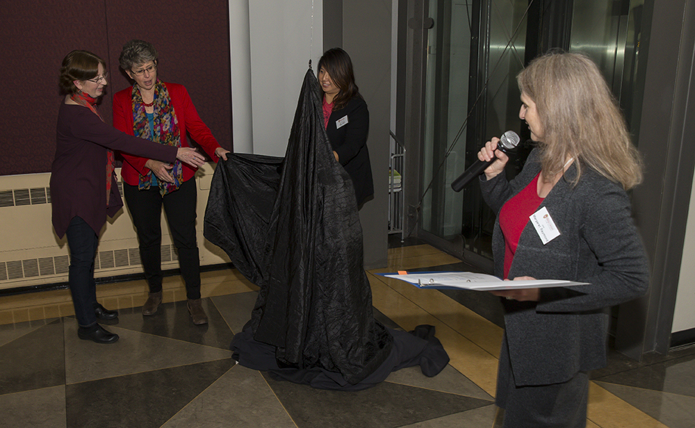 Dean Raymond with JoAnna Rice and Jennifer Bakke and covered gargoyle
