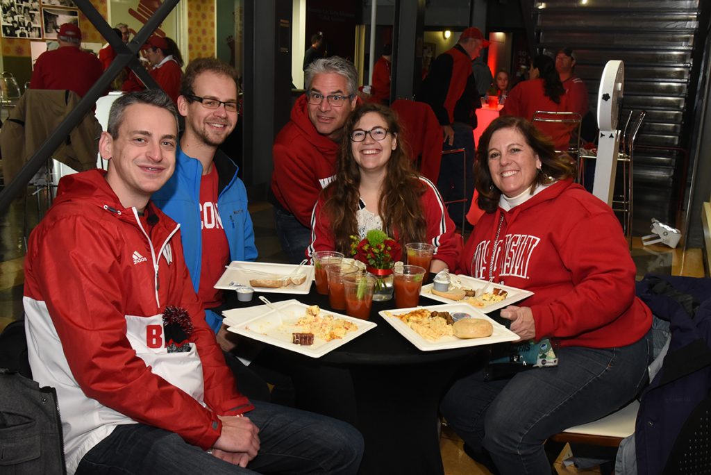 Alumni eating lunch at the tailgate