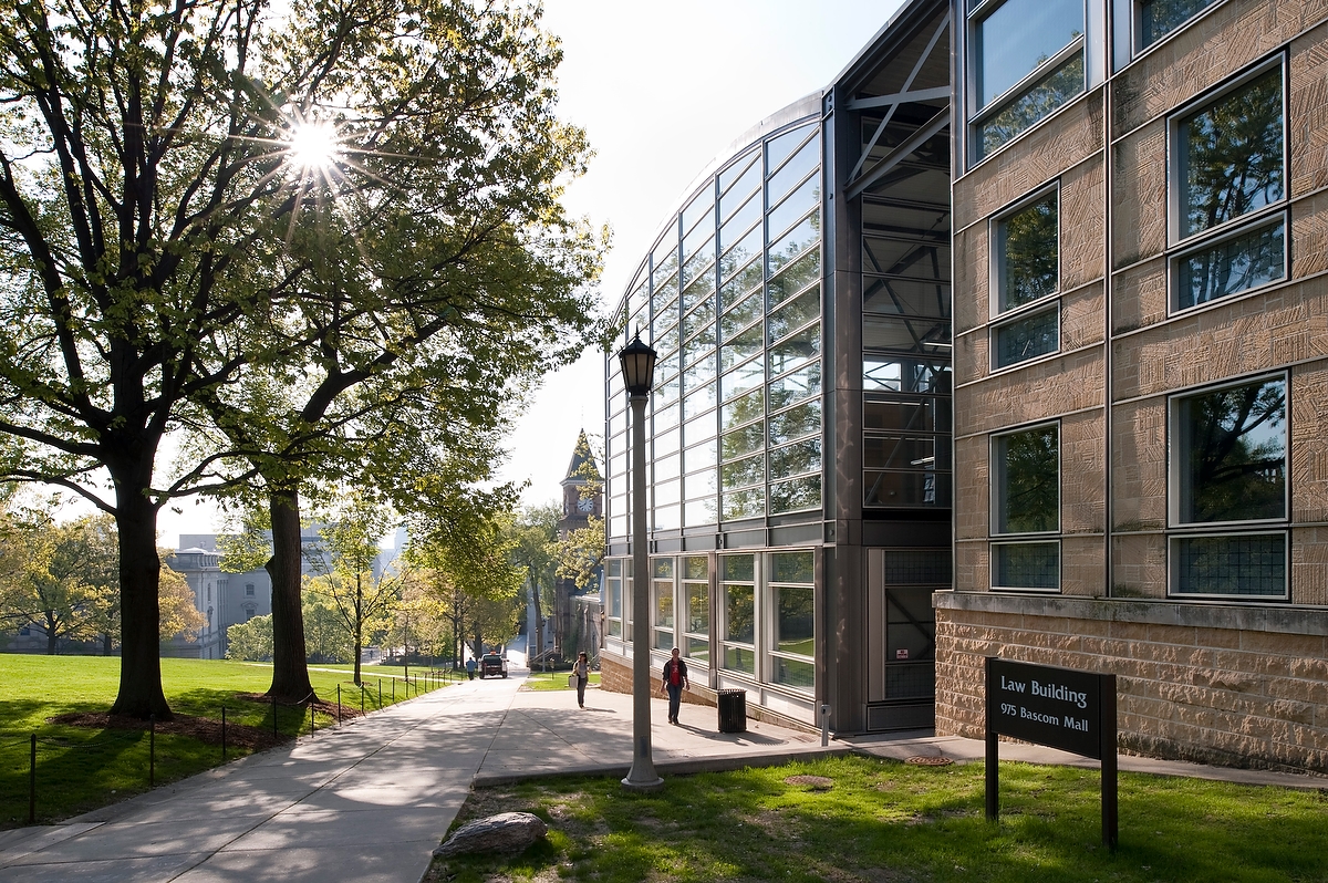 Pedestrians walk past the Law Building (right) the Law Building in 2009.