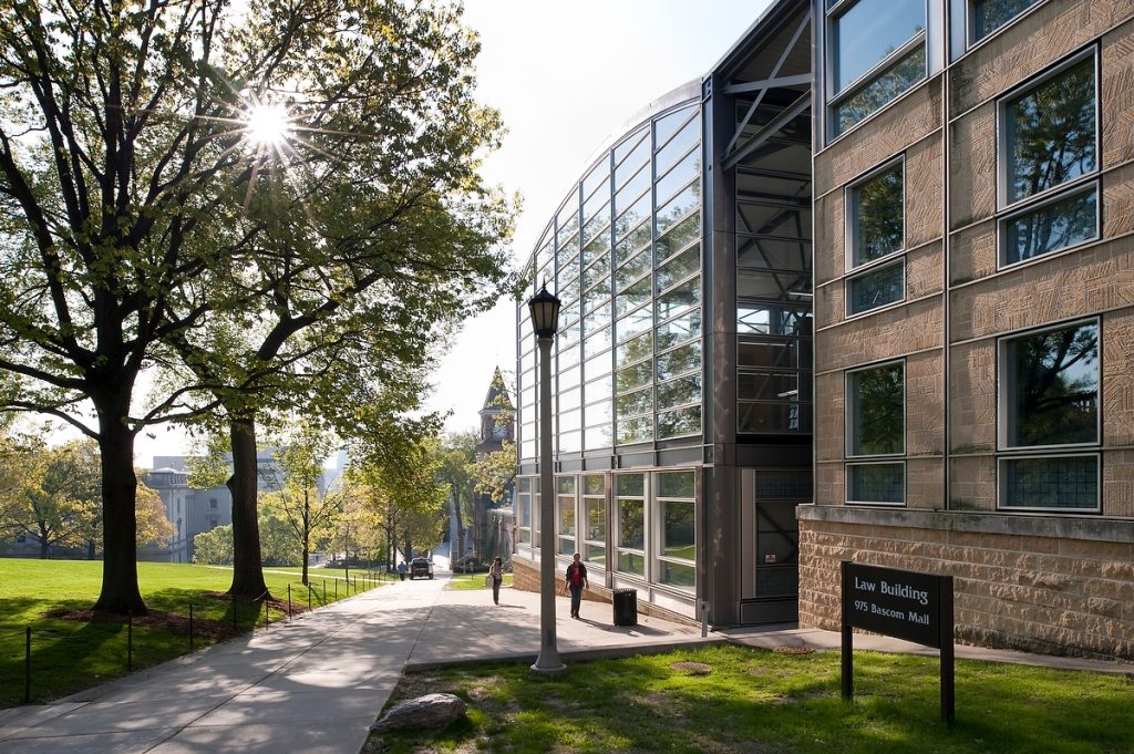 Pedestrians walk past the Law Building (right) the Law Building in 2009.
